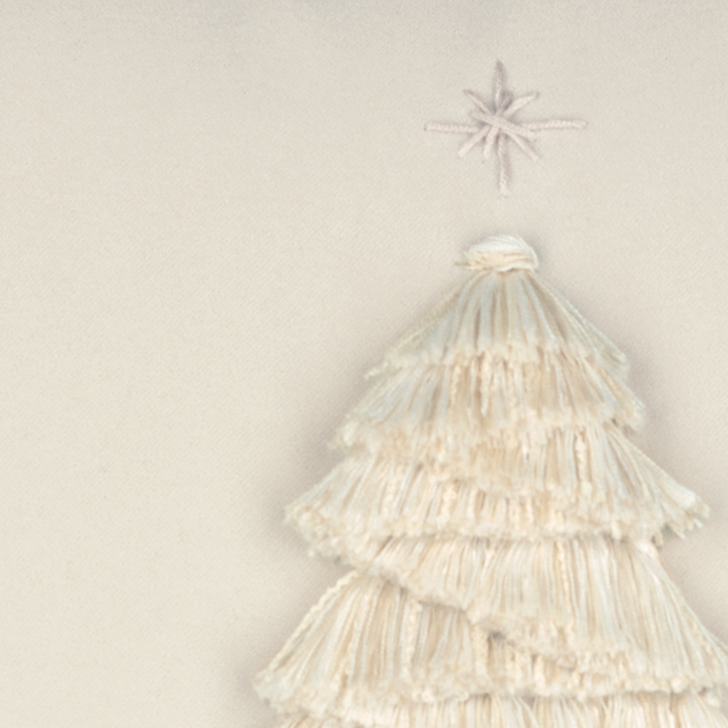 Detail image of Ivory outdoor pillow with holiday tree motif lumbar size for elegant holiday patio decor