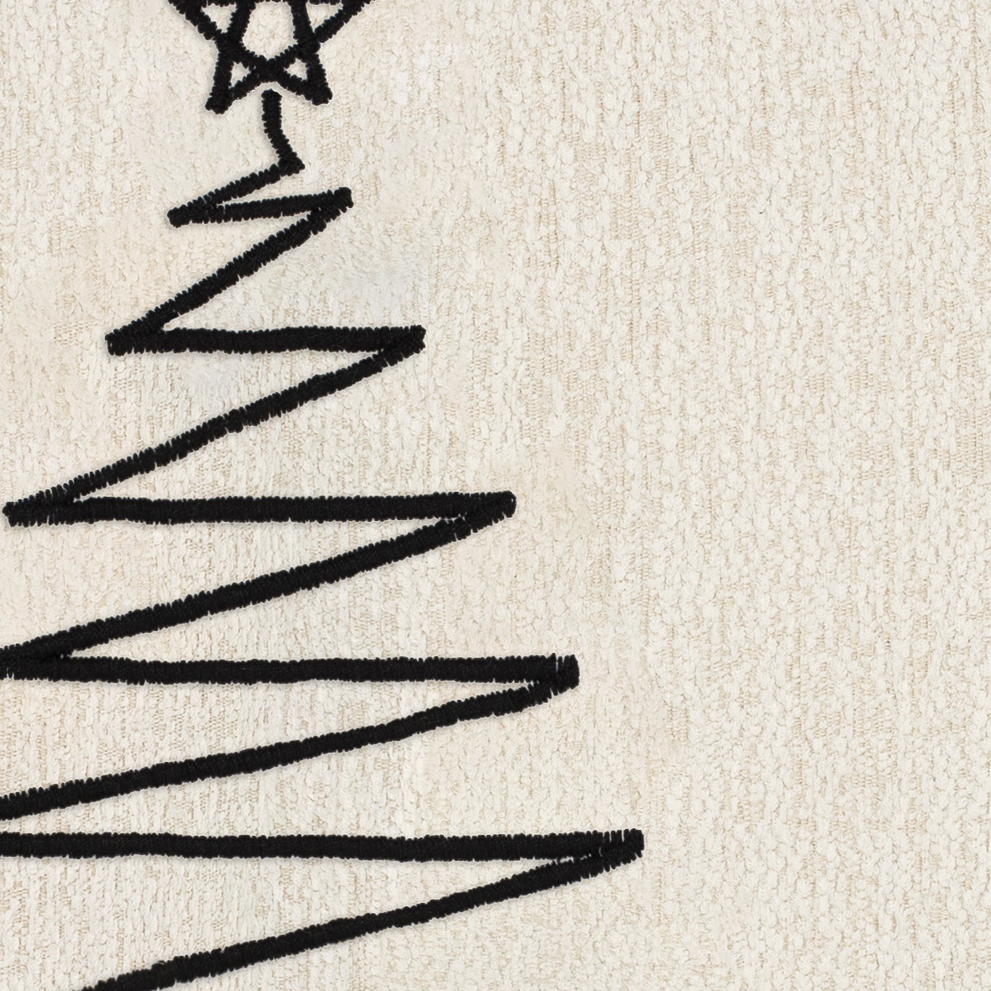 Detail image of Black stitched tree motif on textured ivory ground pillow square size for festive indoor and outdoor decor